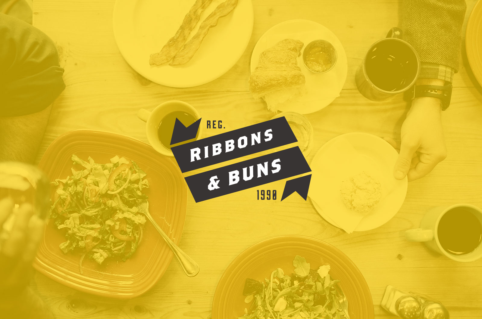 Large white luxury home with green lawn