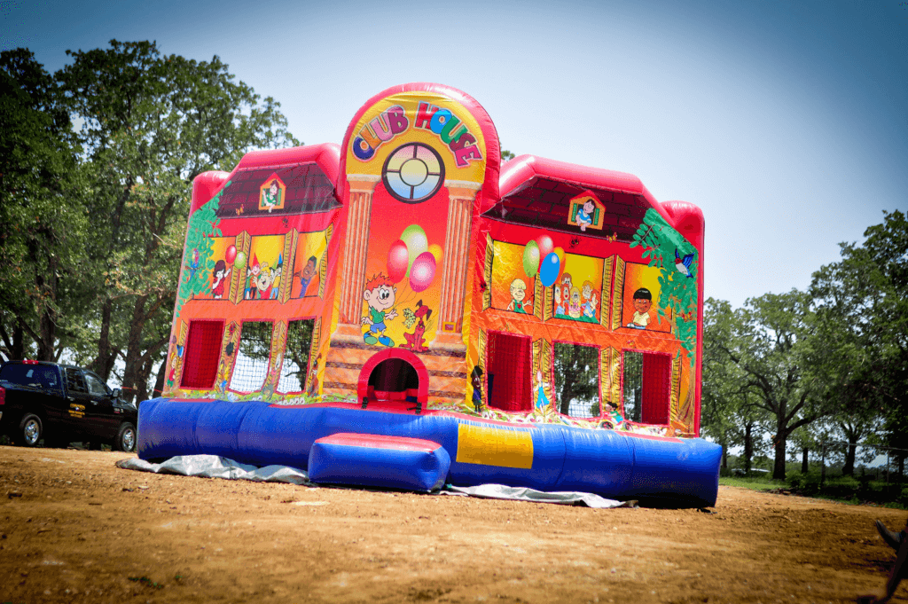 A large inflatable bounce house with many toys.
